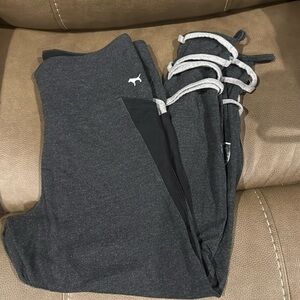 Pink size Large leggings with side pockets and sequin logo and open at ankle